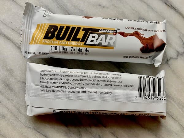 A close up of a Built Bar ingredient list and allergen statement.