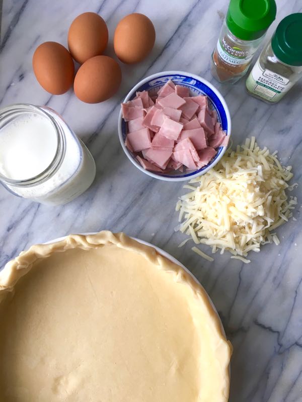 Ingredients displayed for making a ham and cheese quiche