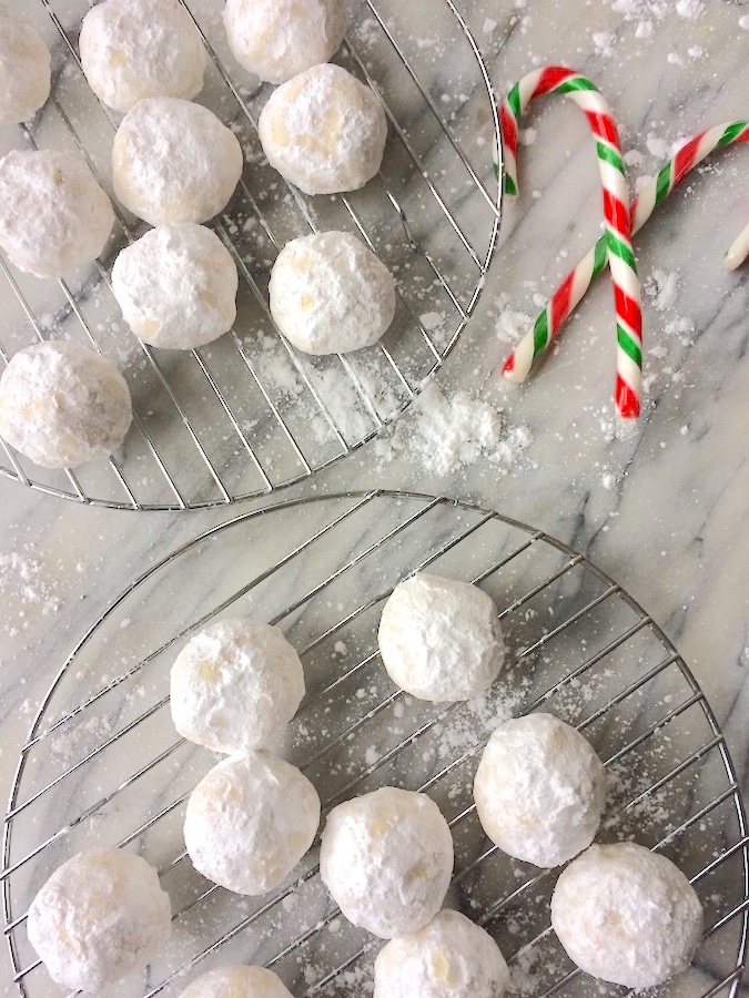 Nut-free snowball cookies covered in powdered sugar.