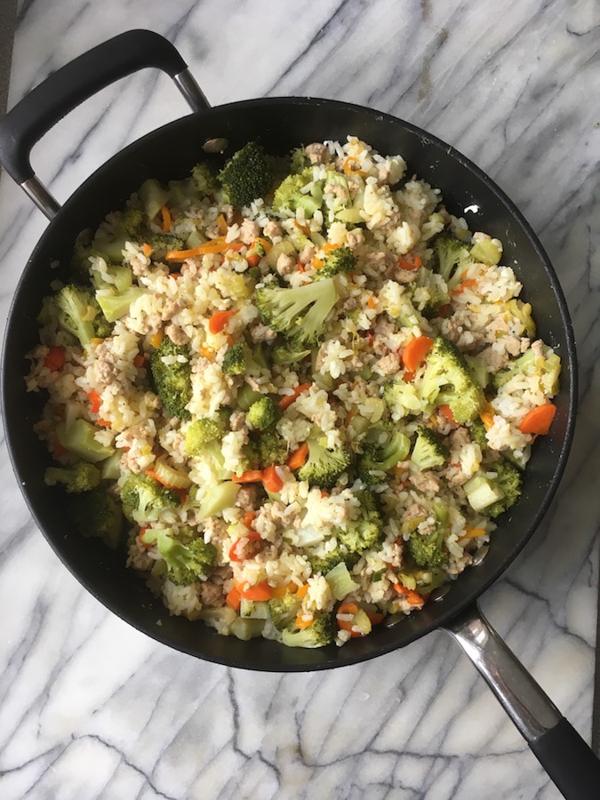 A pan full of vegan fried rice that's allergy friendly.