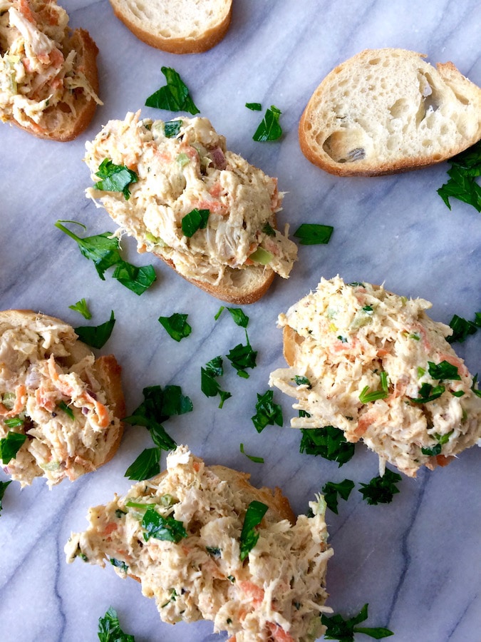 Spoonfuls of curry chicken salad, loaded with goodies, atop toasted slices of baguette.