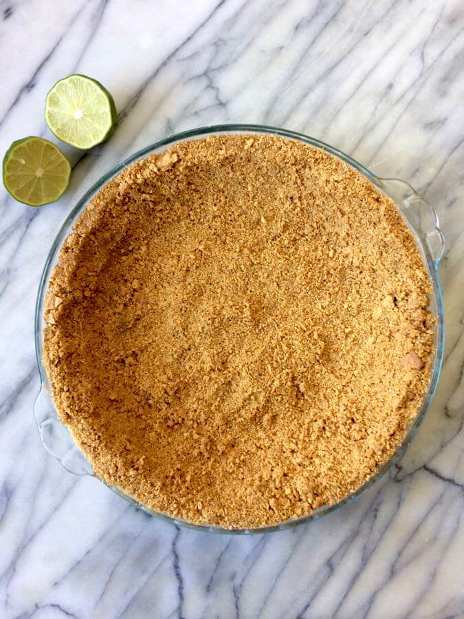 A vegan graham cracker crust that's about to be filled with lime tofu vegan cheesecake filling! #vegan #allergyfriendly #nutfree | flavorpalooza.com