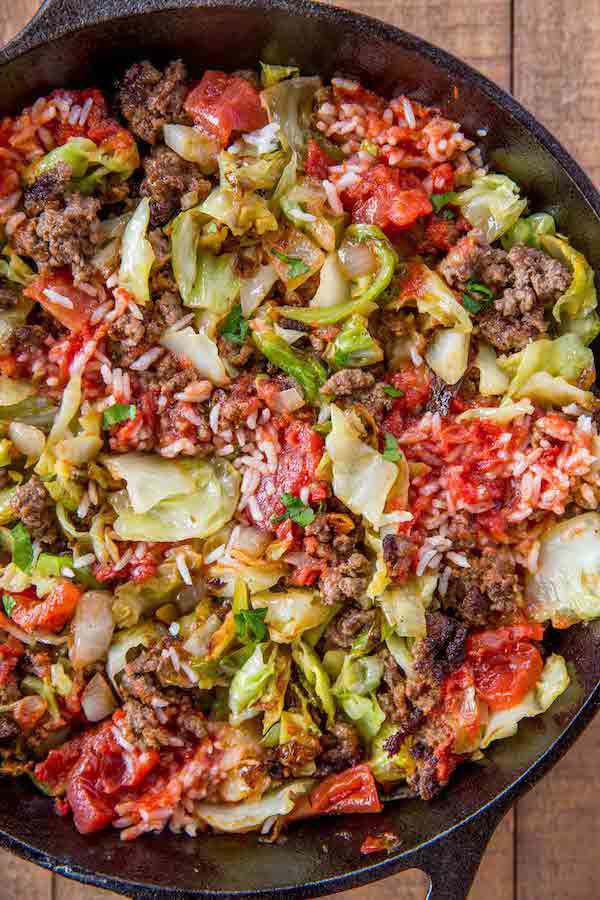 Made with cabbage, beef, onions, rice and a chunky tomato sauce on your stovetop in just 30 minutes, then made crispy in a cast iron skillet. Not like grandma’s cabbage rolls.