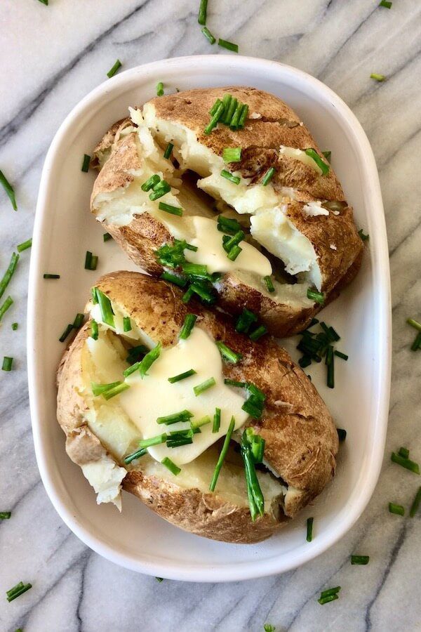 These yummy-looking baked potatoes were actually cooked in the microwave! This recipe makes perfect "baked" potatoes in 10 minutes.