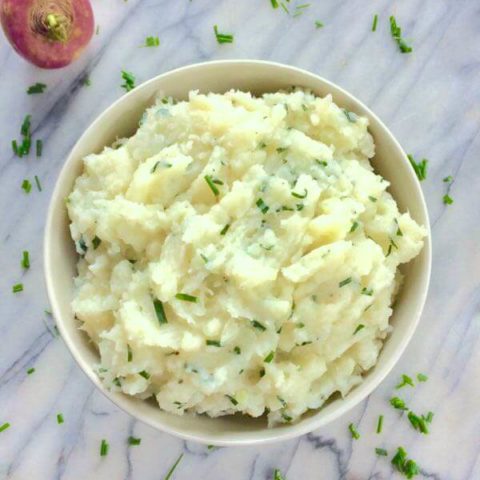 A garlic mashed turnips recipe that's smoothed out with some russet potatoes, butter and milk. It's a healthy side dish that's great for using up all those farm-fresh turnips!