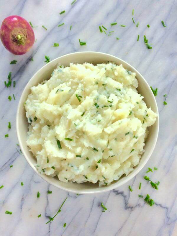 A garlic mashed turnips recipe that's smoothed out with some russet potatoes, butter and milk. It's a healthy side dish that's great for using up all those farm-fresh turnips!